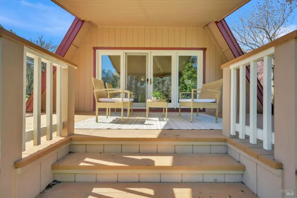 a view of living room with furniture and floor to ceiling window
