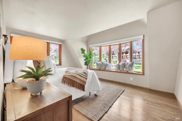 an aerial view of a house with a yard and garden