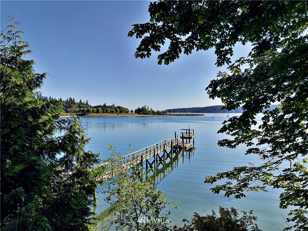 3123 West Sequim Bay Road Sequim, WA 98382 - Photo 3 of 6 a view of a lake with a mountain in the background