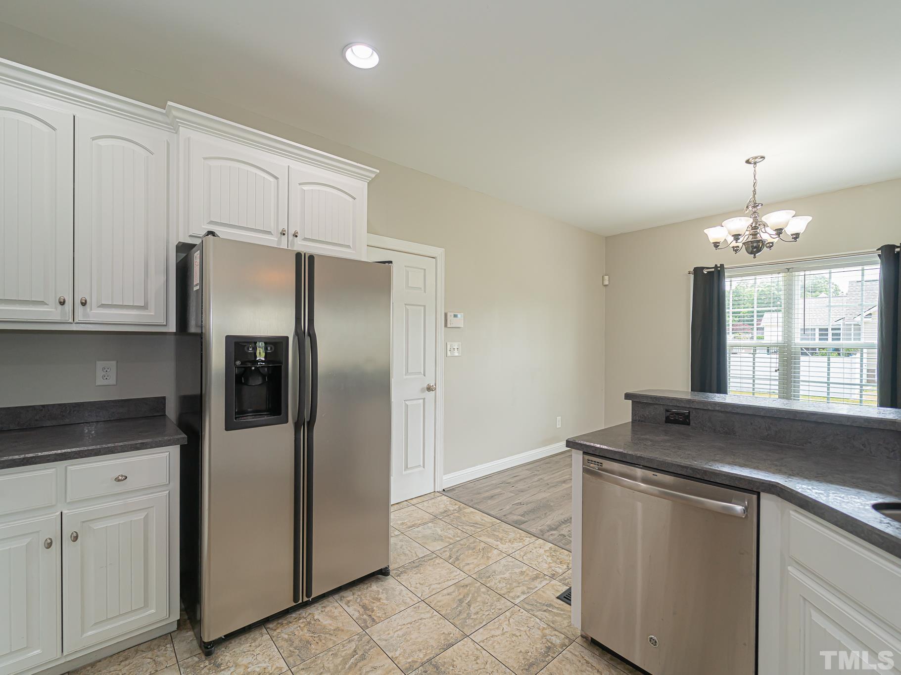 7730 La Finca Road Elm City, NC 27822 - Photo 11 of 29 a kitchen with stainless steel appliances granite countertop a refrigerator and a sink
