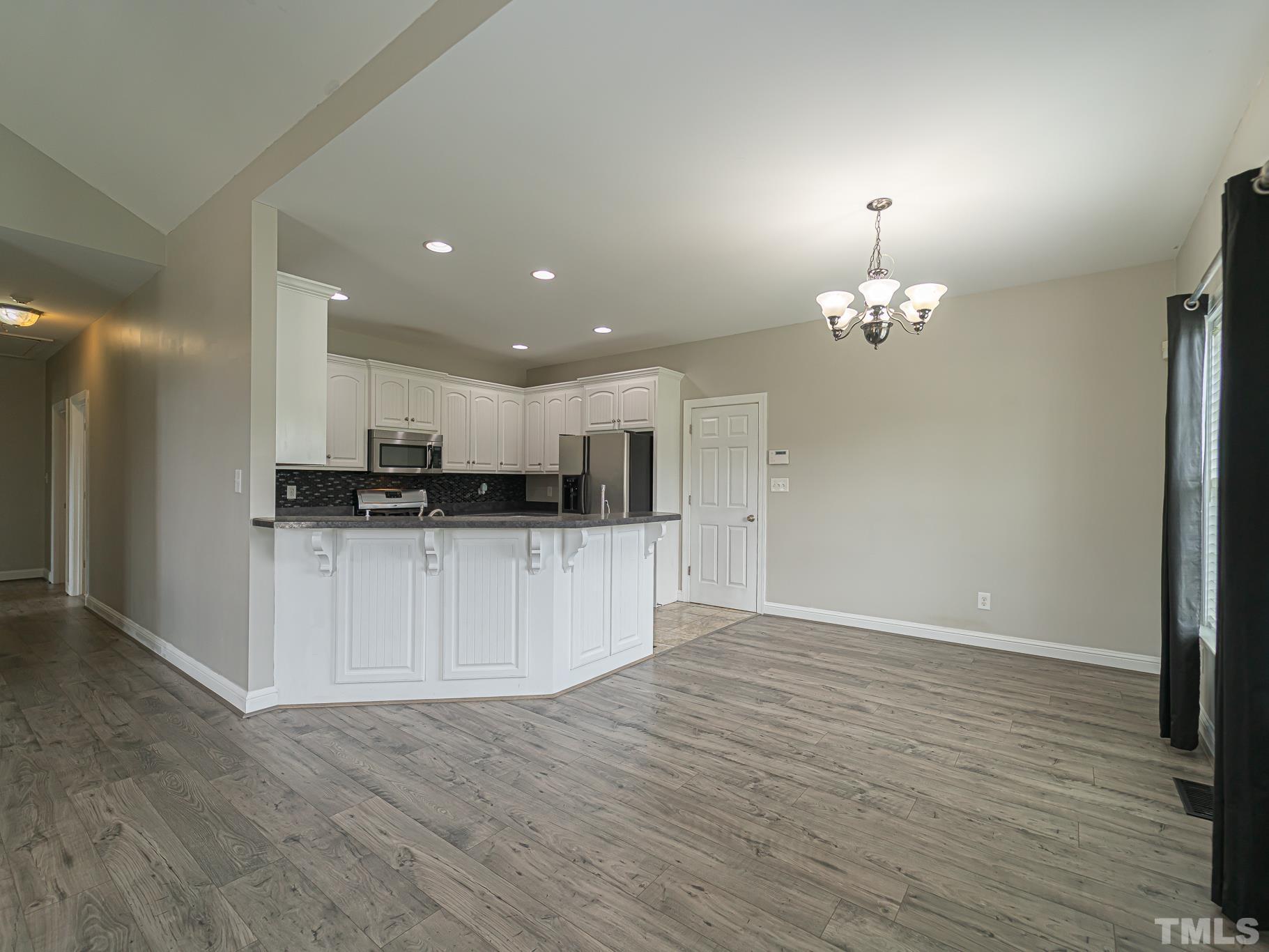 7730 La Finca Road Elm City, NC 27822 - Photo 12 of 29 a view of kitchen with refrigerator and cabinets