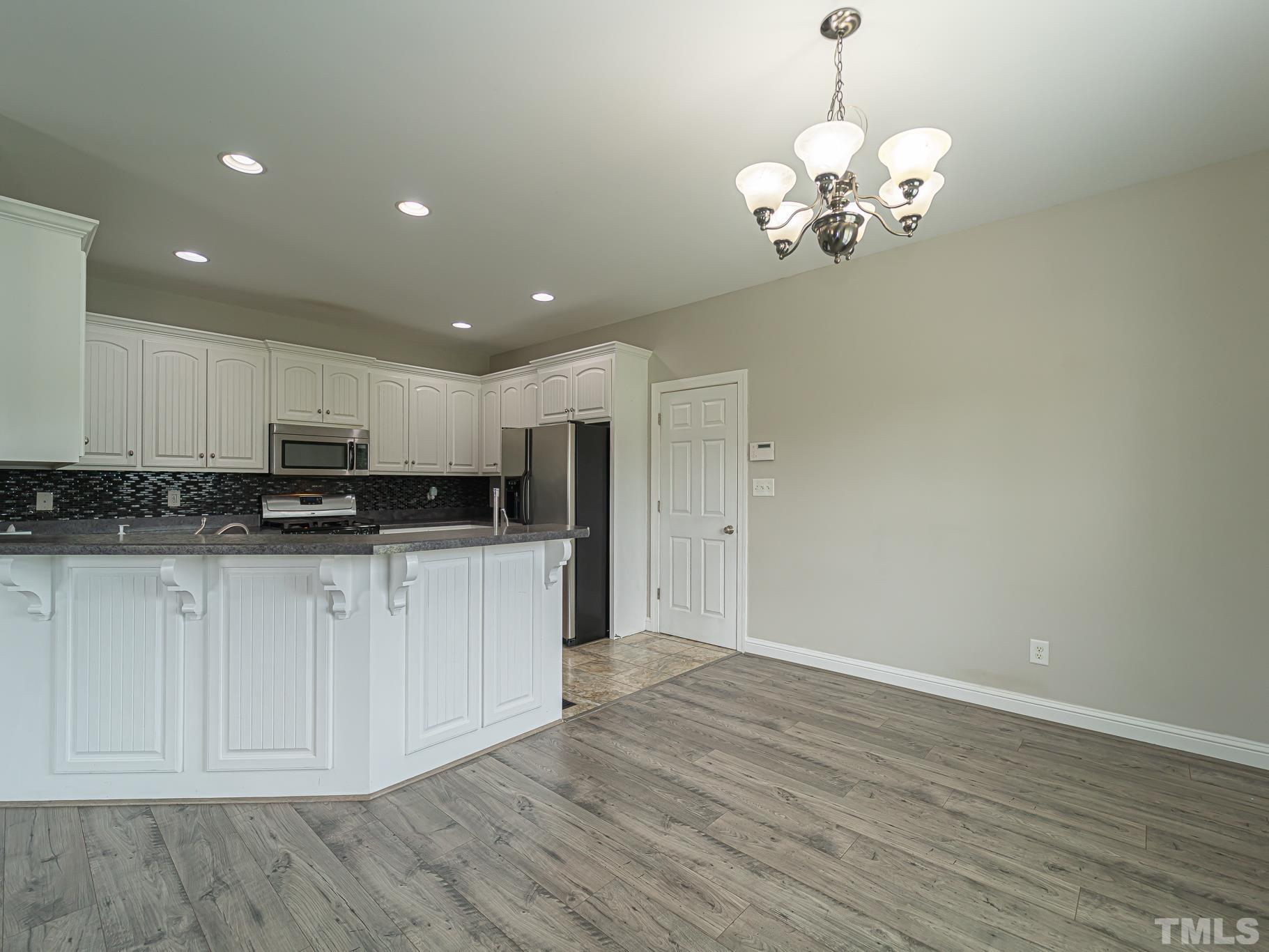 7730 La Finca Road Elm City, NC 27822 - Photo 13 of 29 a view of a kitchen with stainless steel appliances