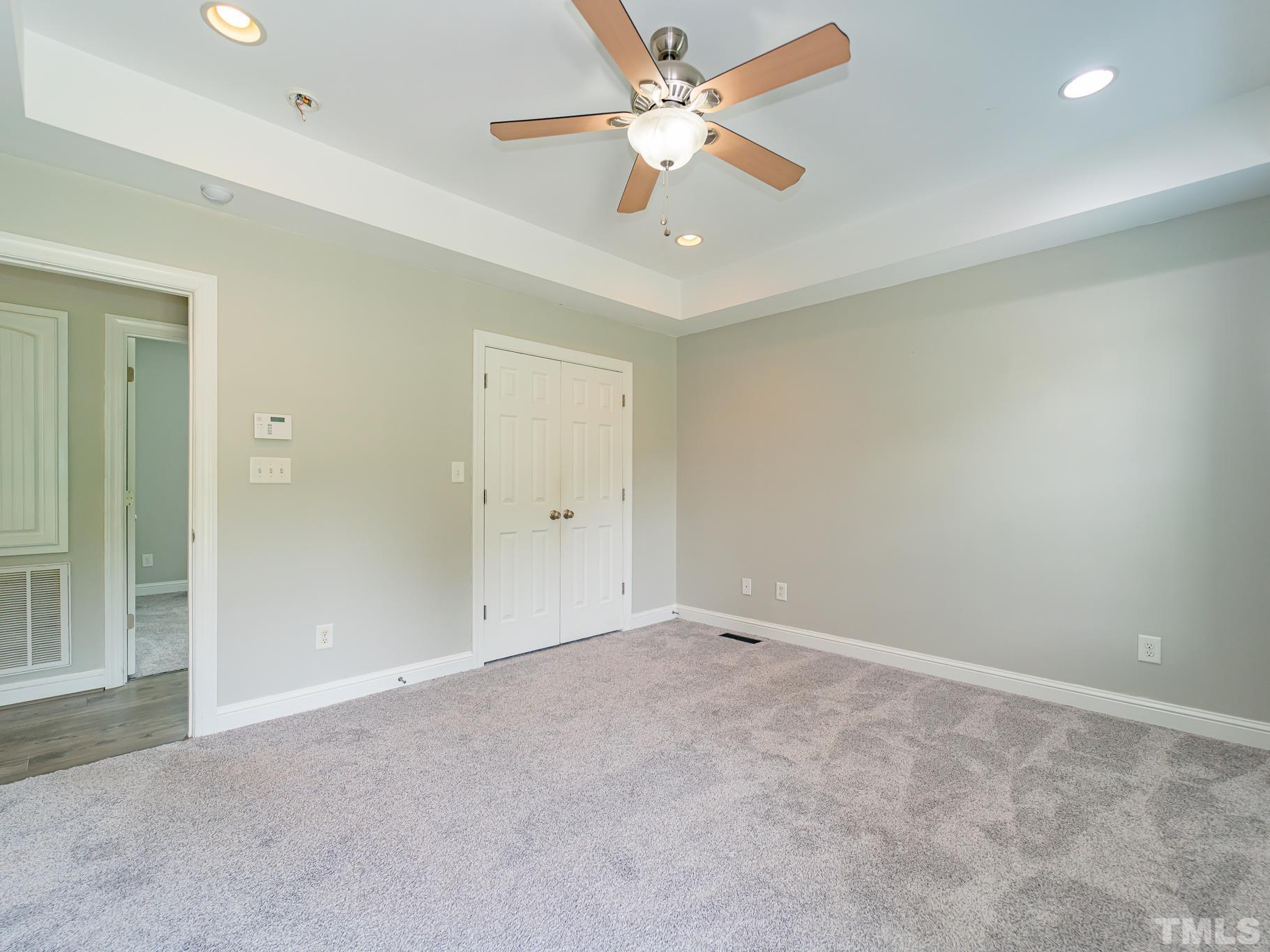 7730 La Finca Road Elm City, NC 27822 - Photo 16 of 29 an empty room with closet and a ceiling fan