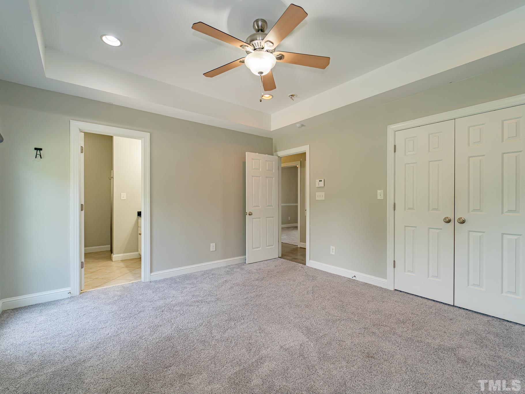 7730 La Finca Road Elm City, NC 27822 - Photo 17 of 29 an empty room with fan and a ceiling fan