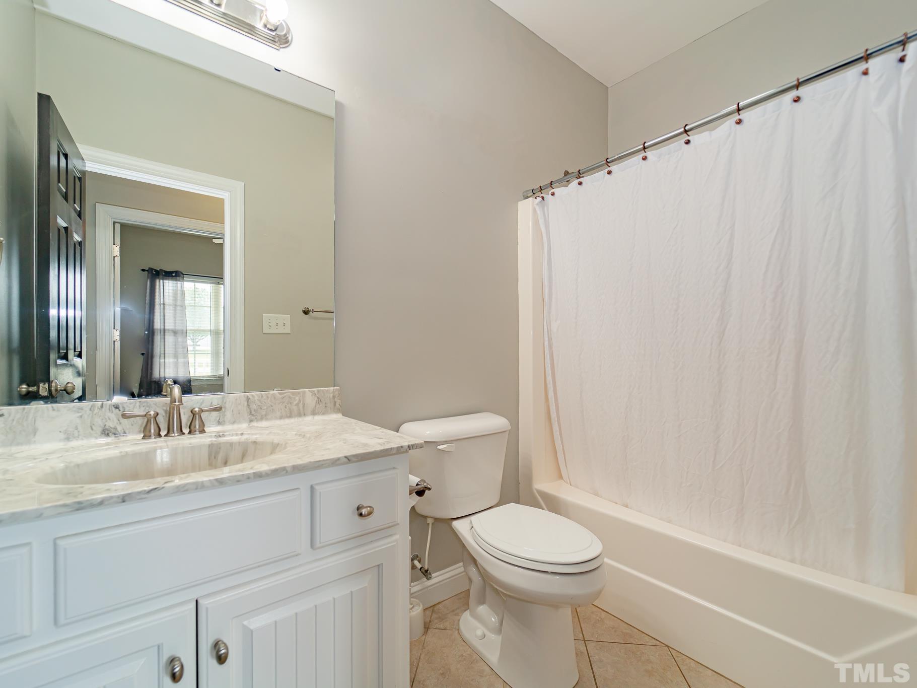 7730 La Finca Road Elm City, NC 27822 - Photo 24 of 29 a bathroom with a sink a toilet and shower