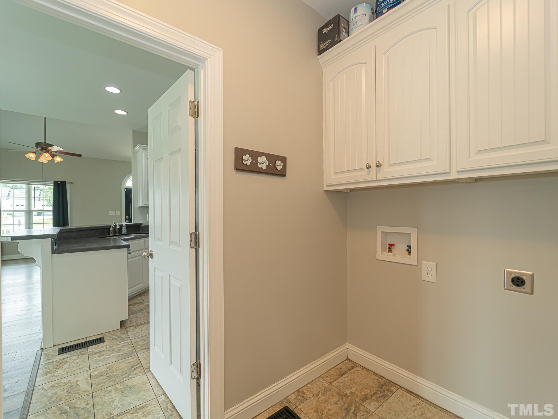 7730 La Finca Road Elm City, NC 27822 - Photo 25 of 29 a view of a kitchen with white cabinets