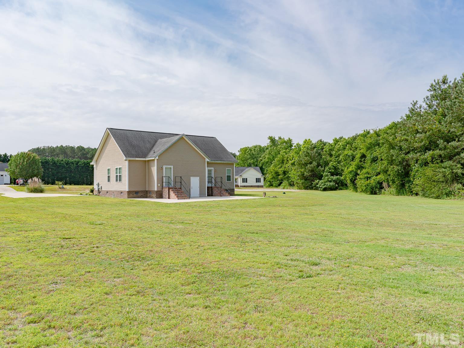 7730 La Finca Road Elm City, NC 27822 - Photo 28 of 29 a view of swimming pool with an outdoor space and seating area