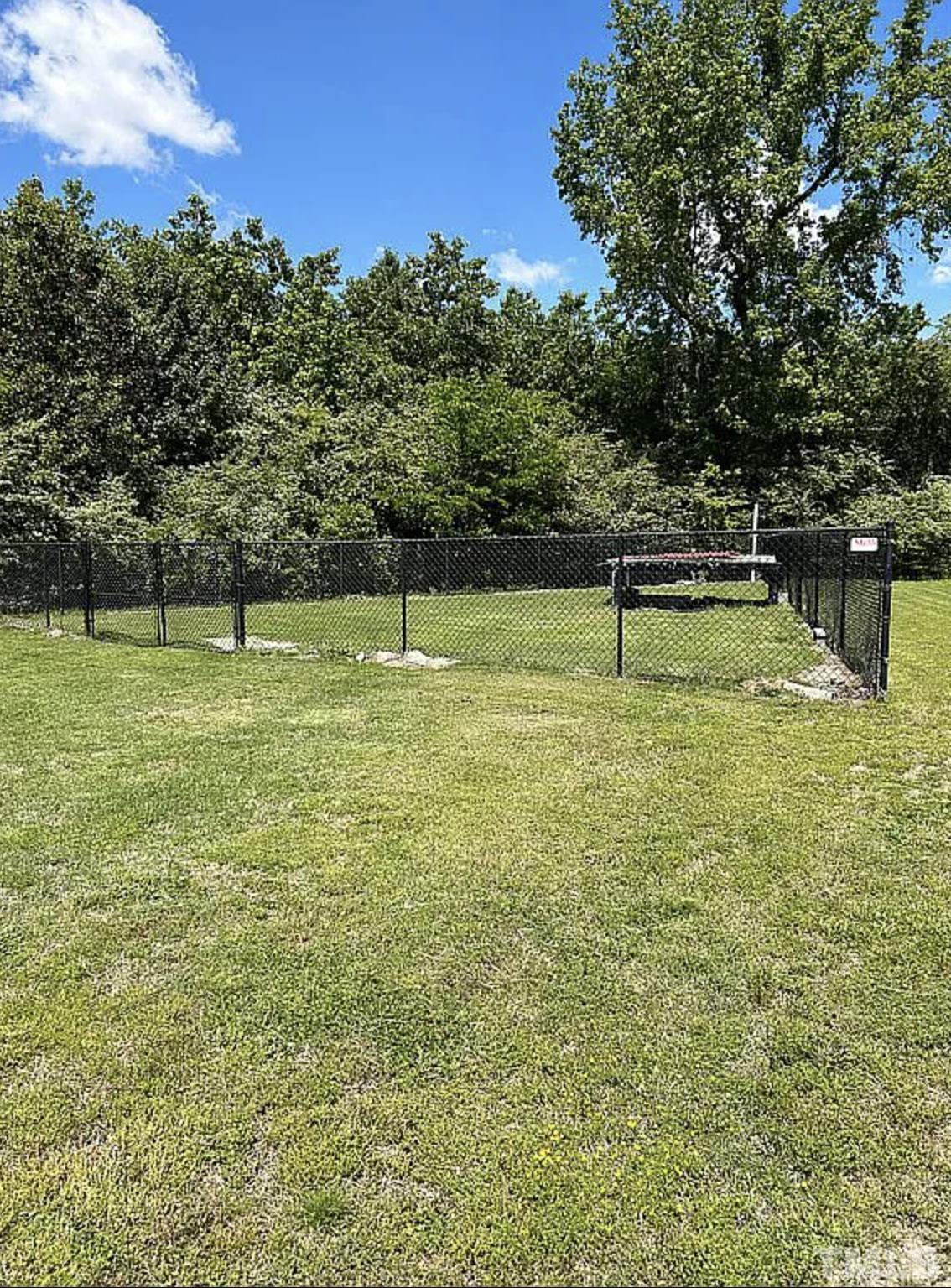 7730 La Finca Road Elm City, NC 27822 - Photo 29 of 29 a view of swimming pool with a yard