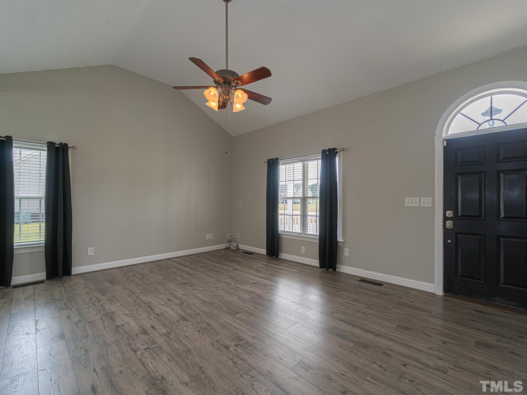7730 La Finca Road Elm City, NC 27822 - Photo 7 of 29 an empty room with wooden floor closet and windows