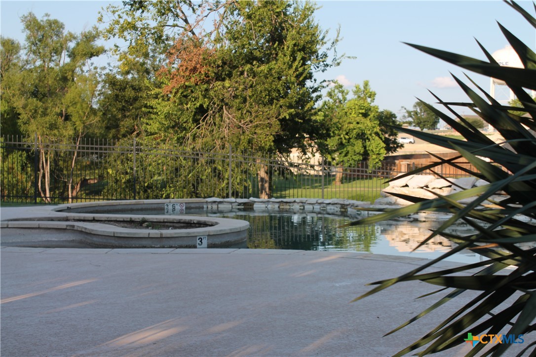 3702 Fall Creek Lane Temple, TX 76504 - Photo 10 of 13 a backyard of a house with lots of green space