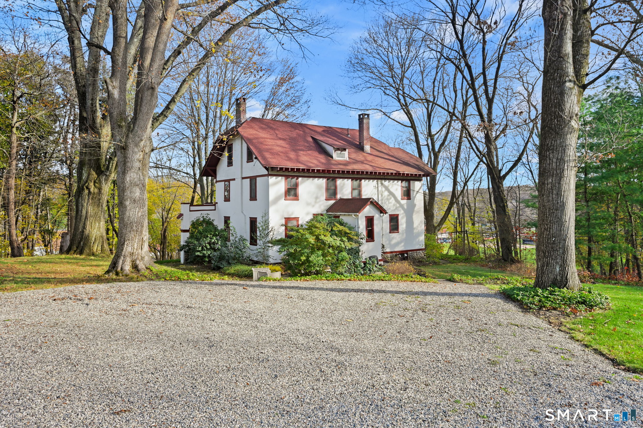32 Catalpa Road Wilton, CT 06897 - Photo 1 of 36 front view of a house with a yard