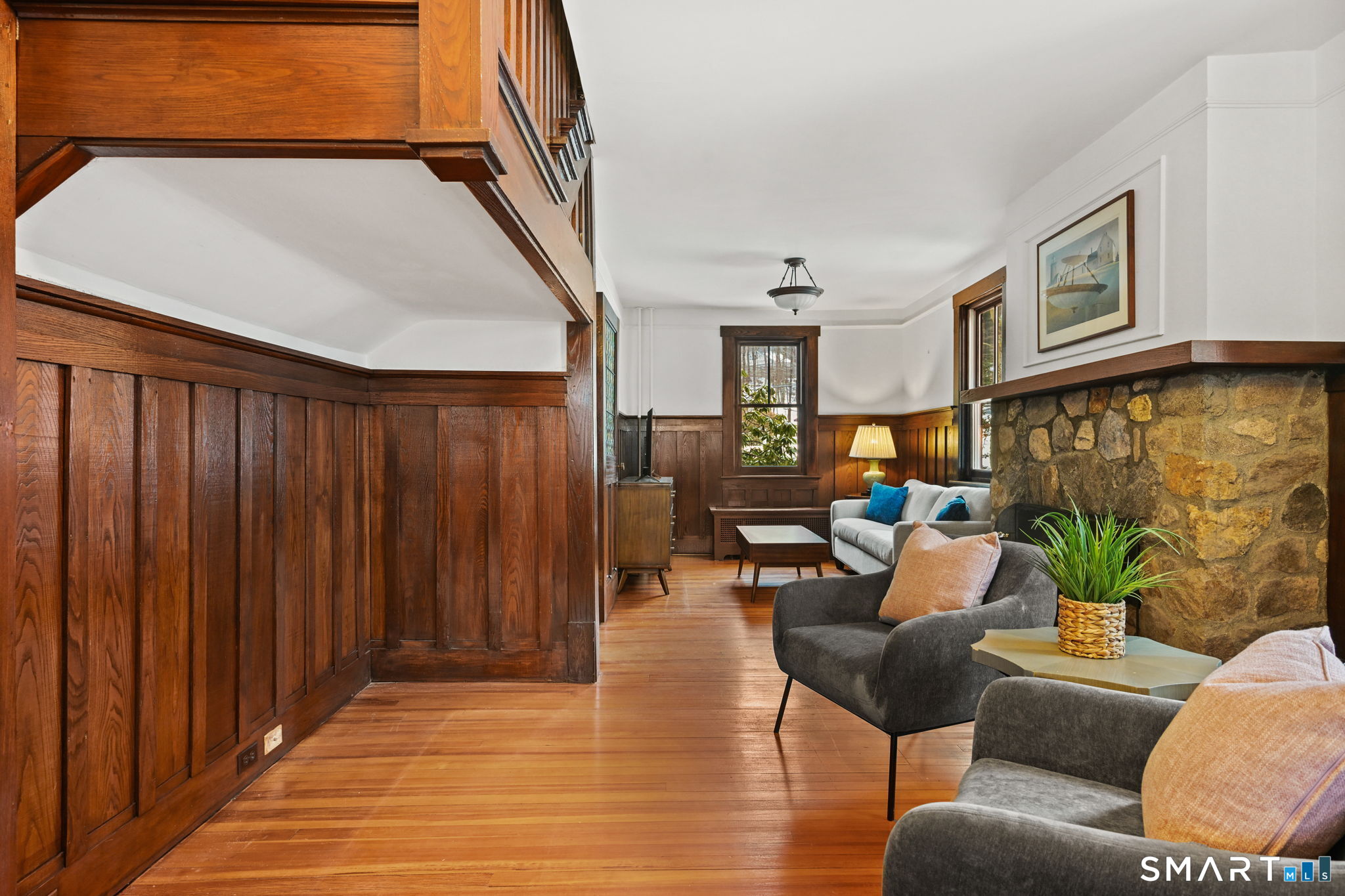 32 Catalpa Road Wilton, CT 06897 - Photo 12 of 36 a living room with furniture and a painting on the wall
