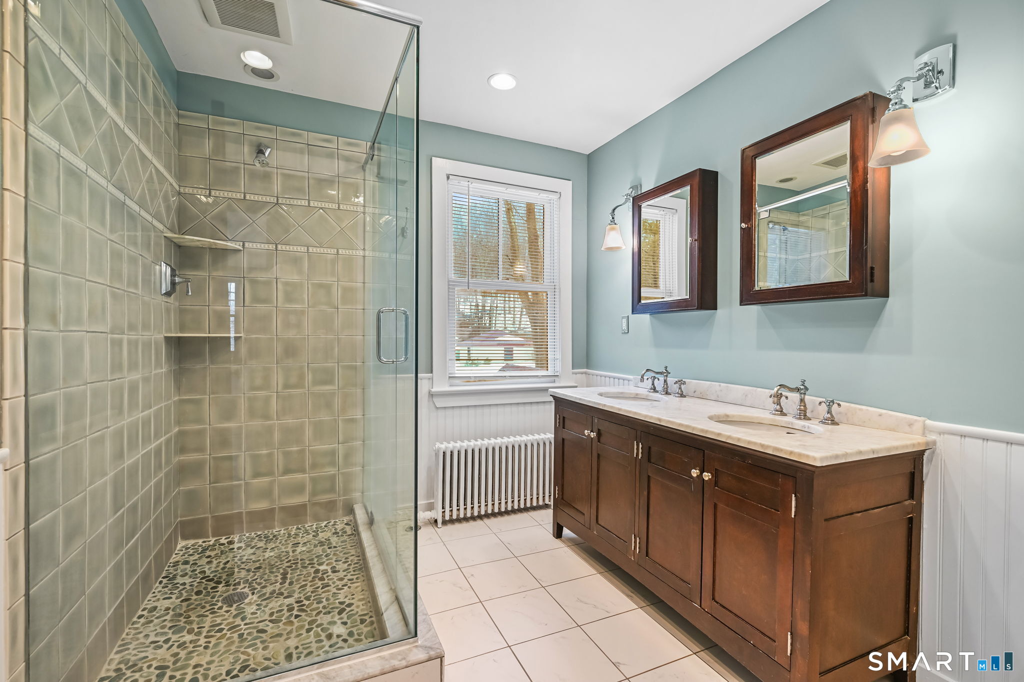 32 Catalpa Road Wilton, CT 06897 - Photo 18 of 36 a bathroom with a sink shower and a mirror