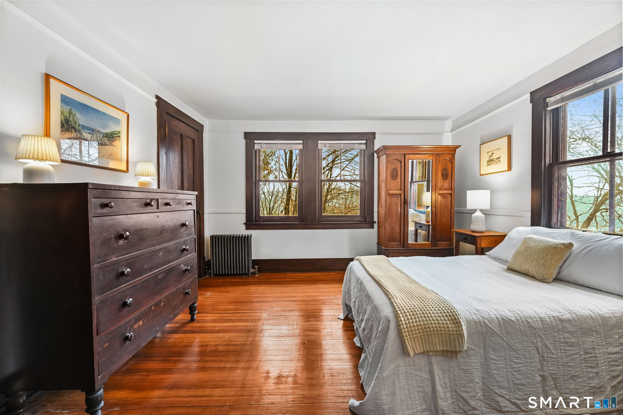 32 Catalpa Road Wilton, CT 06897 - Photo 19 of 36 a bedroom with a bed and a dresser