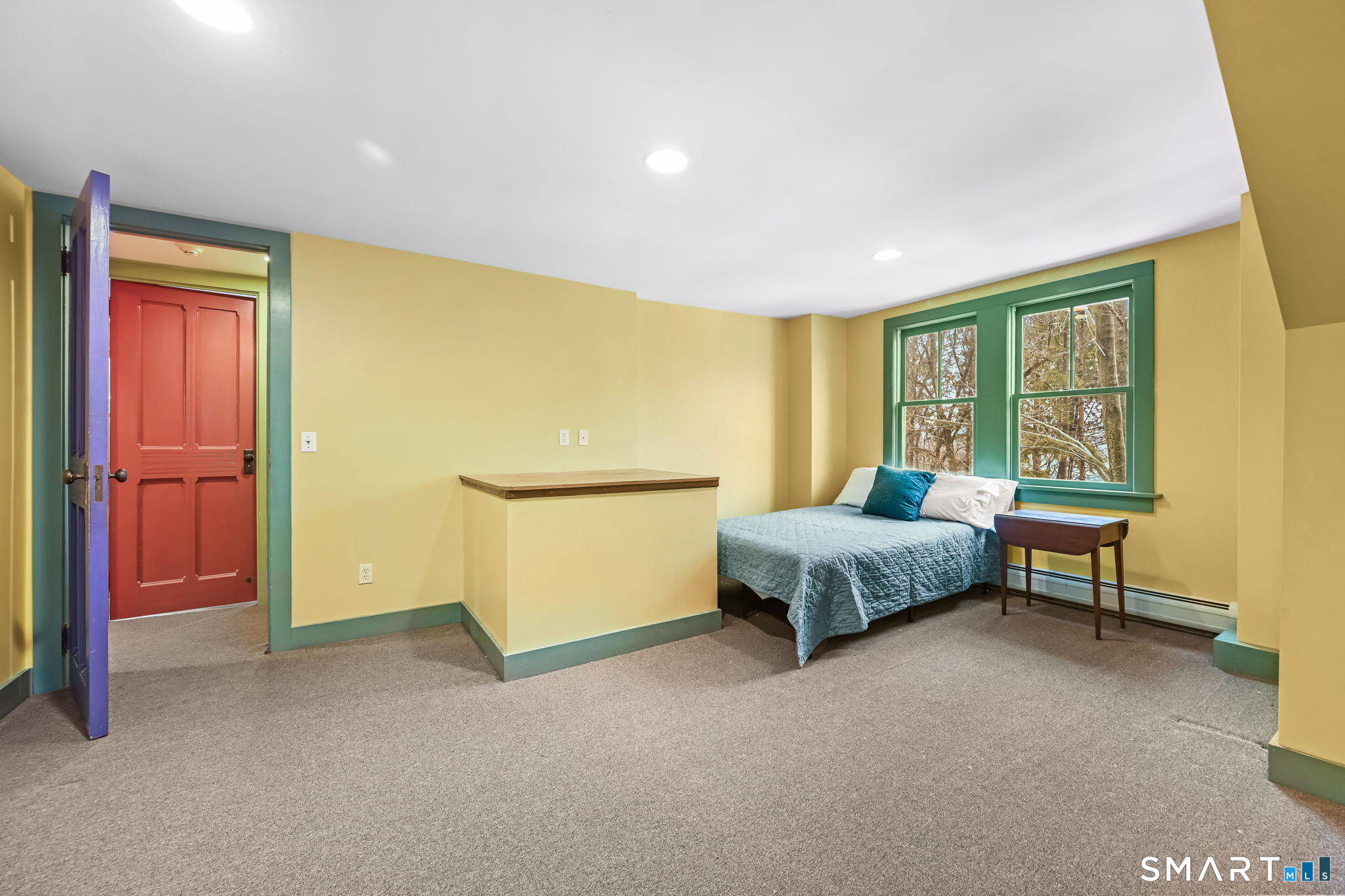 32 Catalpa Road Wilton, CT 06897 - Photo 24 of 36 a spacious bedroom with a bed and a table in it