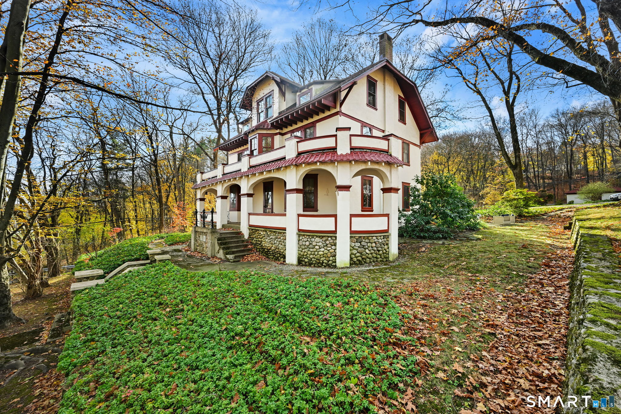 32 Catalpa Road Wilton, CT 06897 - Photo 30 of 36 a front view of a house with a yard