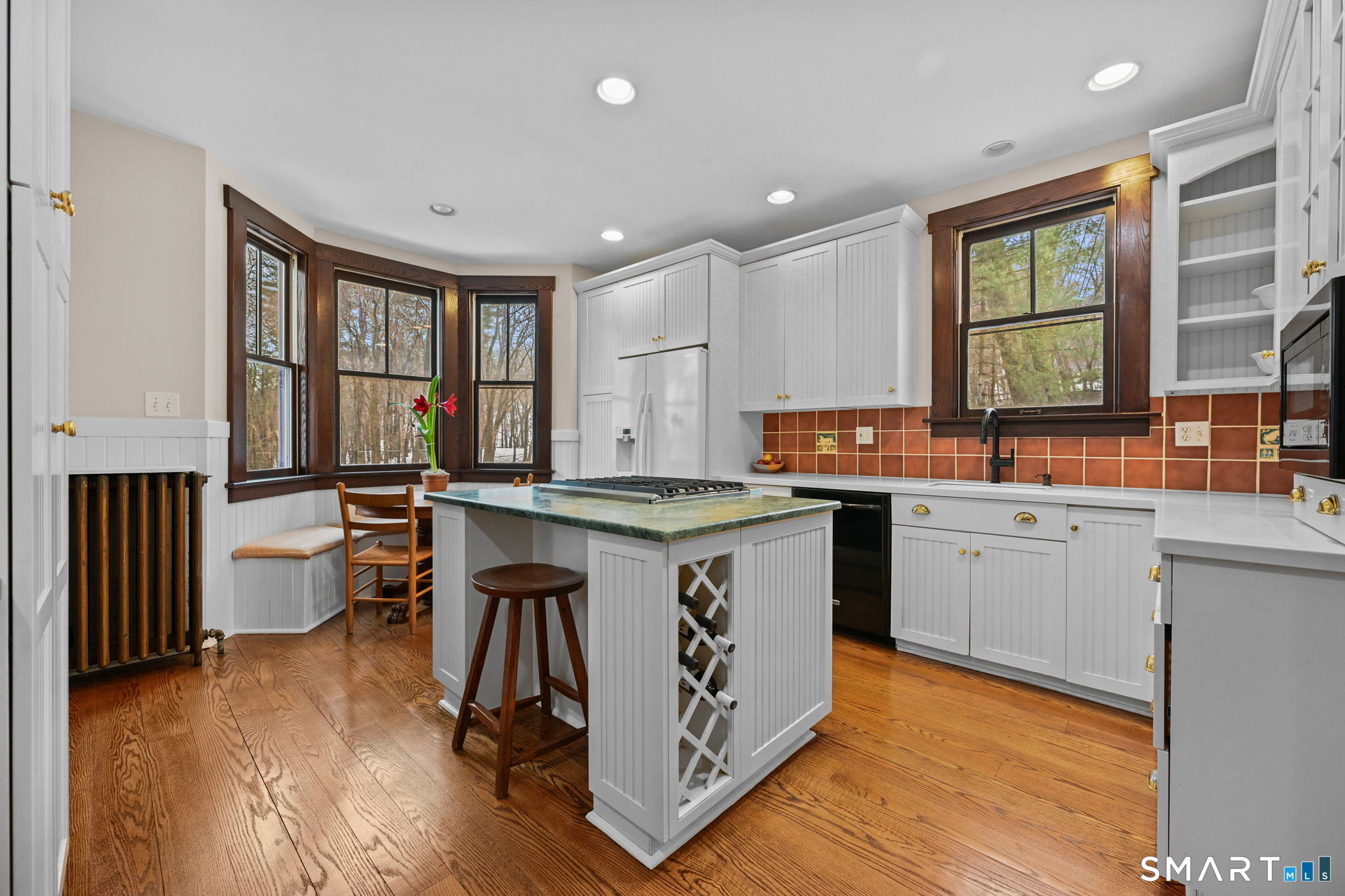 32 Catalpa Road Wilton, CT 06897 - Photo 3 of 36 a kitchen with a sink stove and cabinets