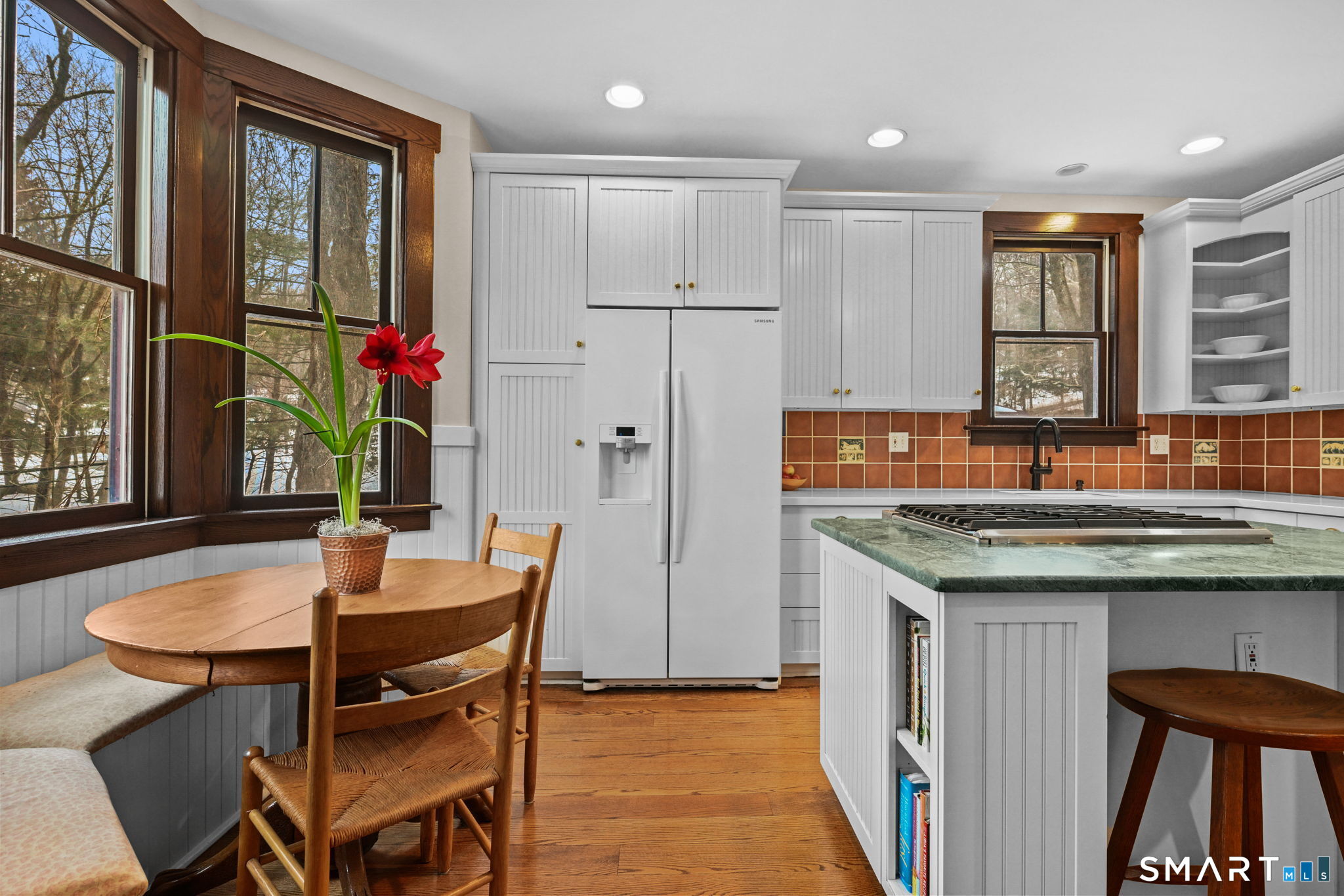 32 Catalpa Road Wilton, CT 06897 - Photo 4 of 36 a kitchen with a table chairs refrigerator and cabinets
