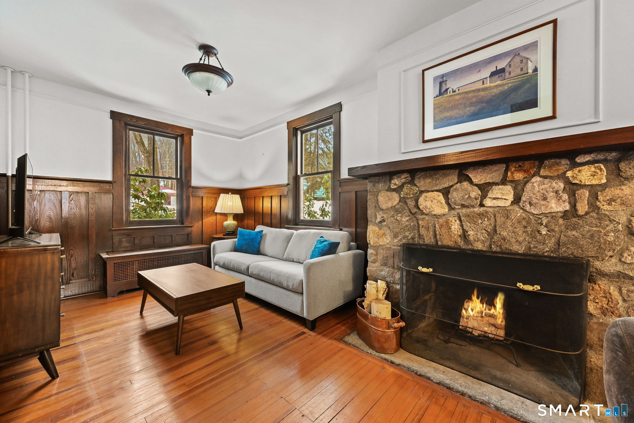 32 Catalpa Road Wilton, CT 06897 - Photo 10 of 36 a living room with furniture and a fireplace