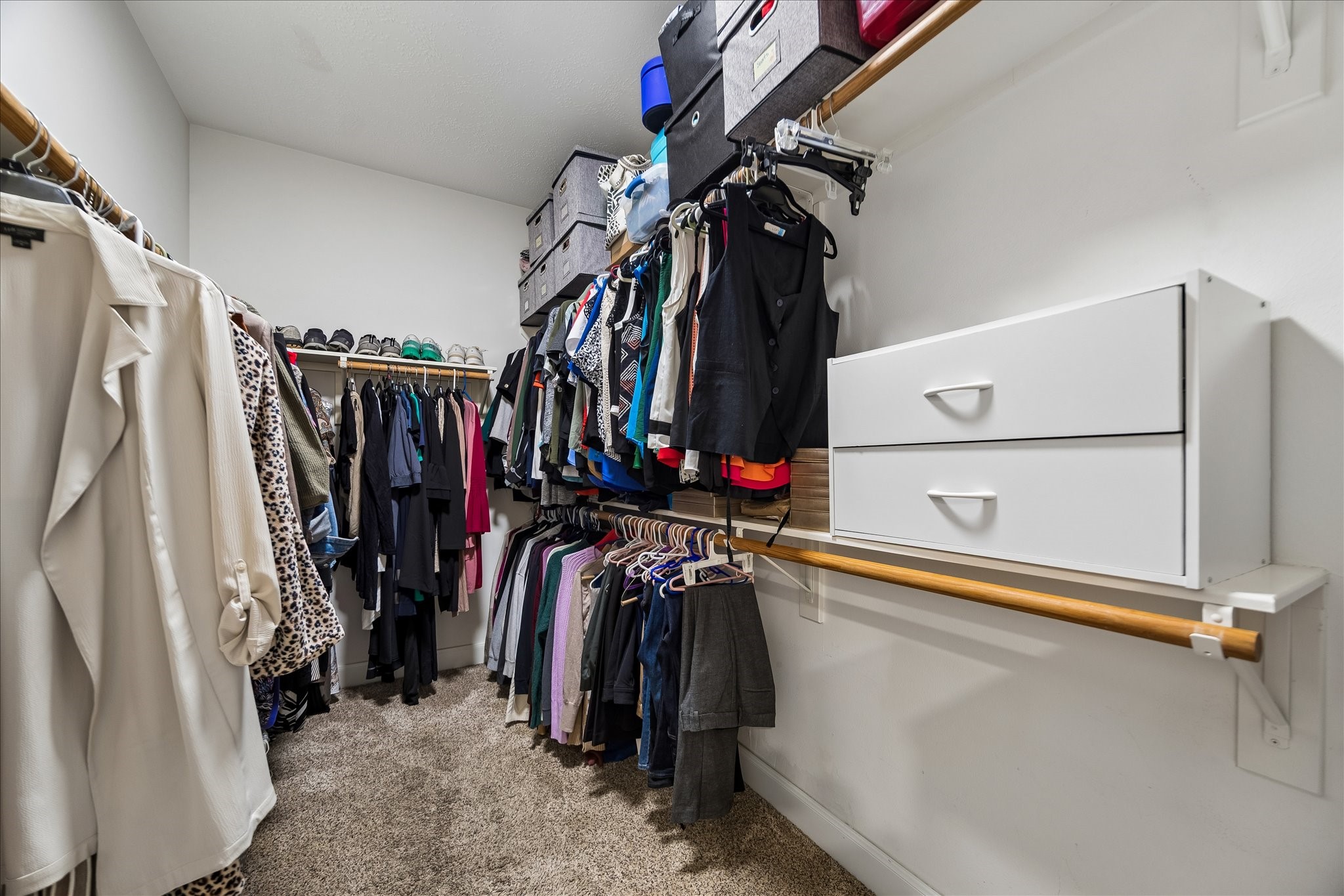 23039 Enchanted Landing Lane Katy, TX 77494 - Photo 21 of 30 a view of walk in closet with clothes and shoes