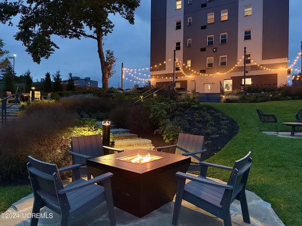a view of a patio with table and chairs and potted plants