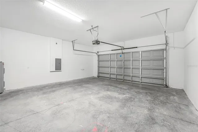 a view of a backyard with swimming pool