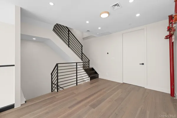 an entryway in a hall with a window