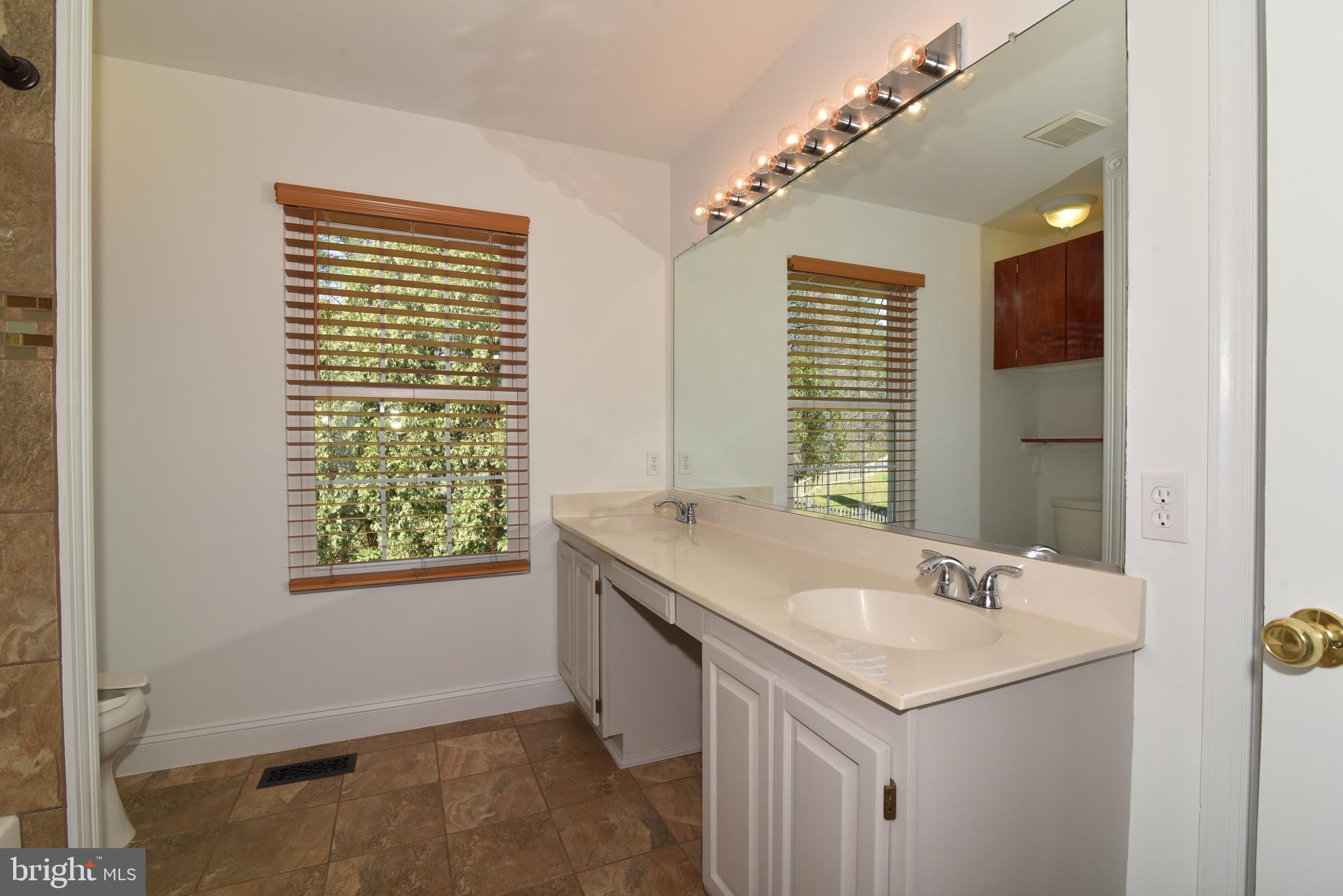 453 Foxridge Drive Southwest Leesburg, VA 20175 - Photo 22 of 35 Primary Bathroom with Double Sinks and large WIC
