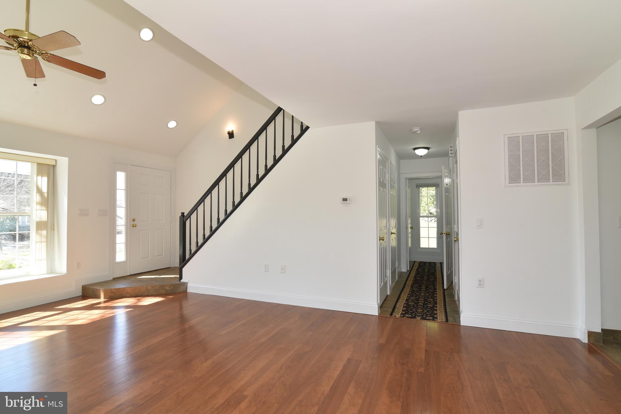453 Foxridge Drive Southwest Leesburg, VA 20175 - Photo 6 of 35 View of Foyer, Stairs, and Hall from Dining Room