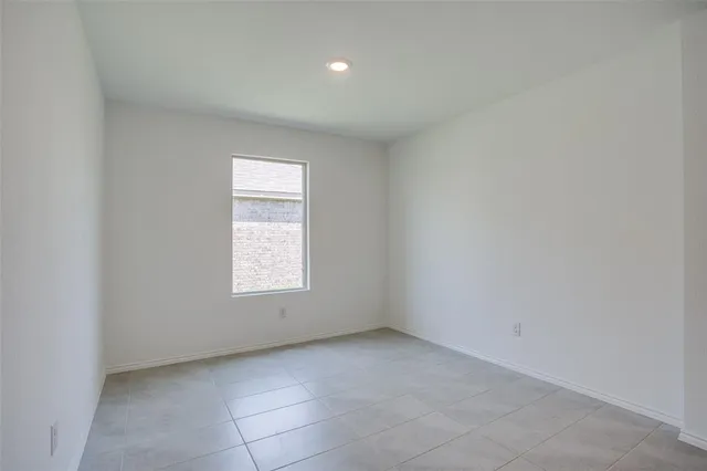 a view of yard with grass and wooden fence