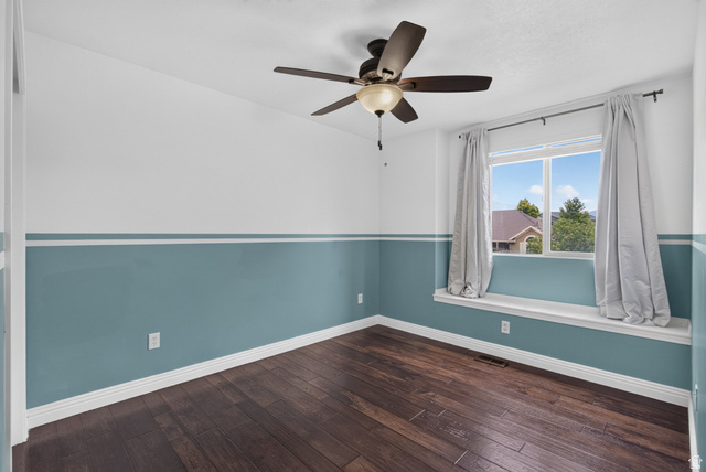 2223 North Pointe Meadow Loop Lehi, UT 84048 - Photo 29 of 56 Room featuring wood-finish flooring, a ceiling fan with integrated lighting, and a large window with a built-in window seat