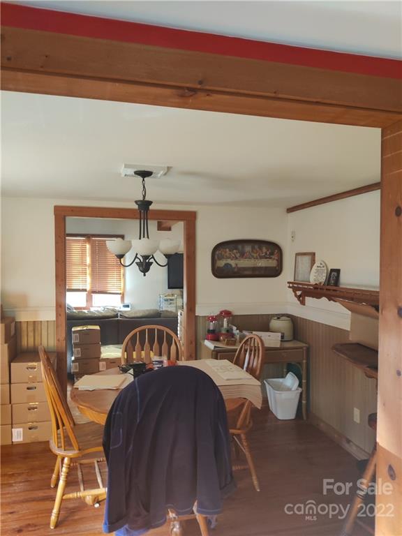 903 Middlefork Road Brevard, NC 28712 - Photo 2 of 11 a bedroom with furniture and a chandelier