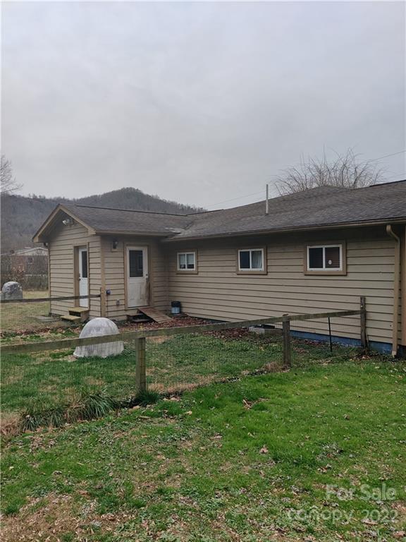 903 Middlefork Road Brevard, NC 28712 - Photo 9 of 11 a backyard of a house with yard table and chairs