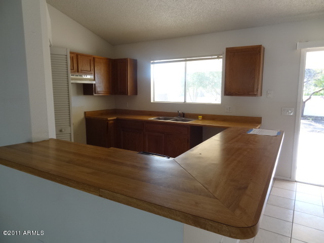 4467 East Pearce Road Phoenix, AZ 85044 - Photo 11 of 25 023-142253- kitchen 2