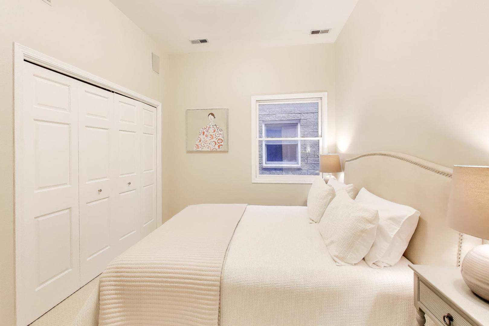 1312 West Fletcher Street, Unit 3W Chicago, IL 60657 - Photo 15 of 30 a bedroom with a bed and a window