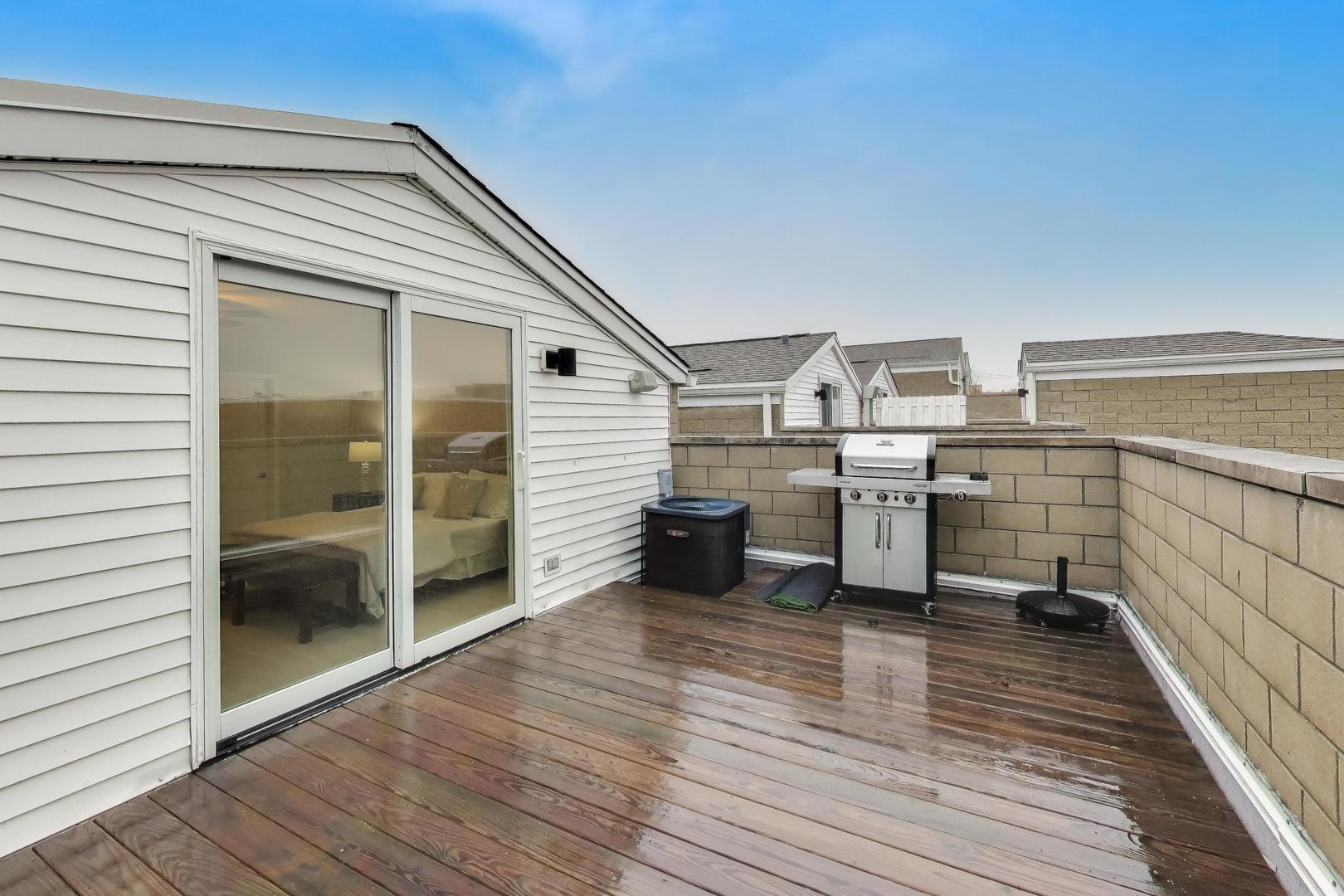 1312 West Fletcher Street, Unit 3W Chicago, IL 60657 - Photo 28 of 30 a room view with wooden floor and furniture