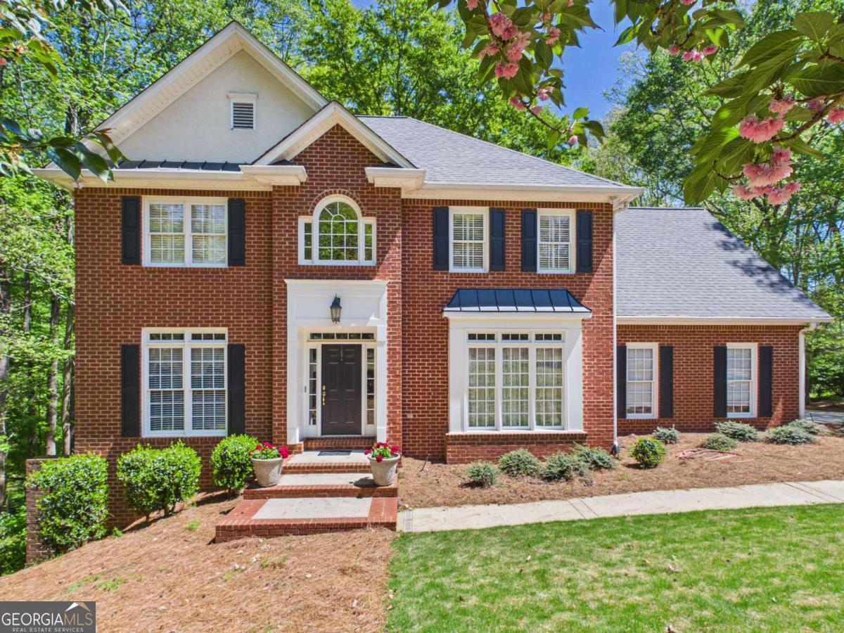 1120 Laurel Pointe Watkinsville, GA 30677 - Photo 1 of 50 a front view of a house with a yard and porch