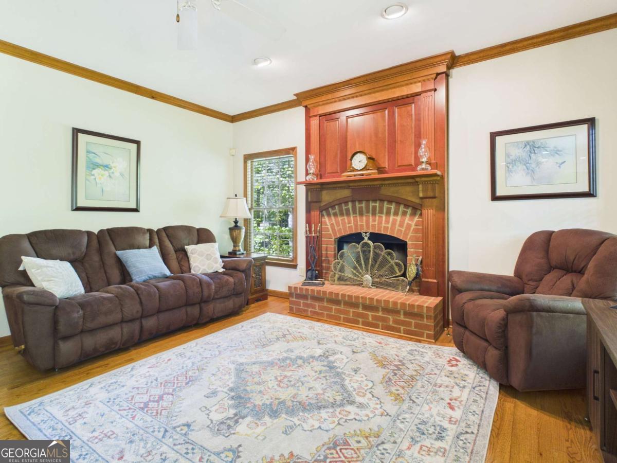 1120 Laurel Pointe Watkinsville, GA 30677 - Photo 12 of 50 a living room with furniture and a fireplace