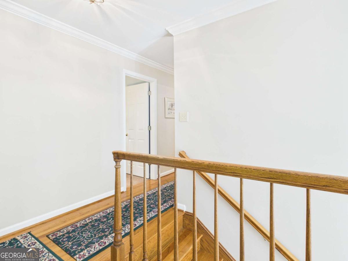 1120 Laurel Pointe Watkinsville, GA 30677 - Photo 17 of 50 a view of staircase with railing and a window