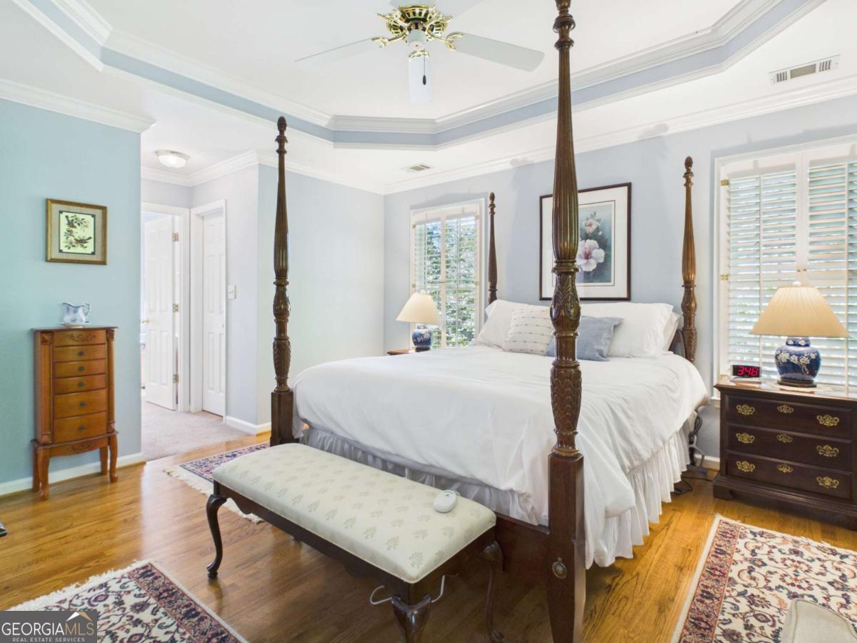 1120 Laurel Pointe Watkinsville, GA 30677 - Photo 19 of 50 a bedroom with a bed and wooden floor