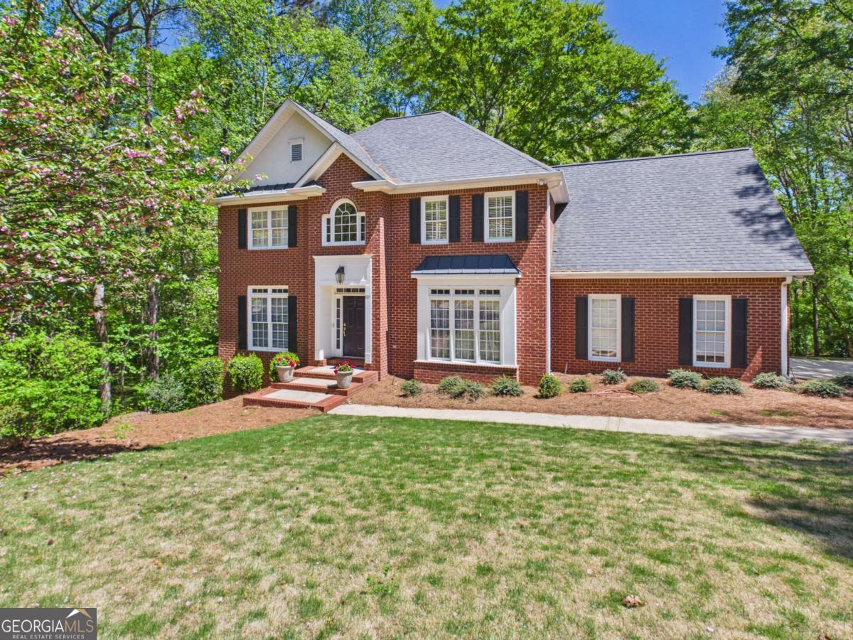 1120 Laurel Pointe Watkinsville, GA 30677 - Photo 2 of 50 a front view of a house with yard and outdoor seating