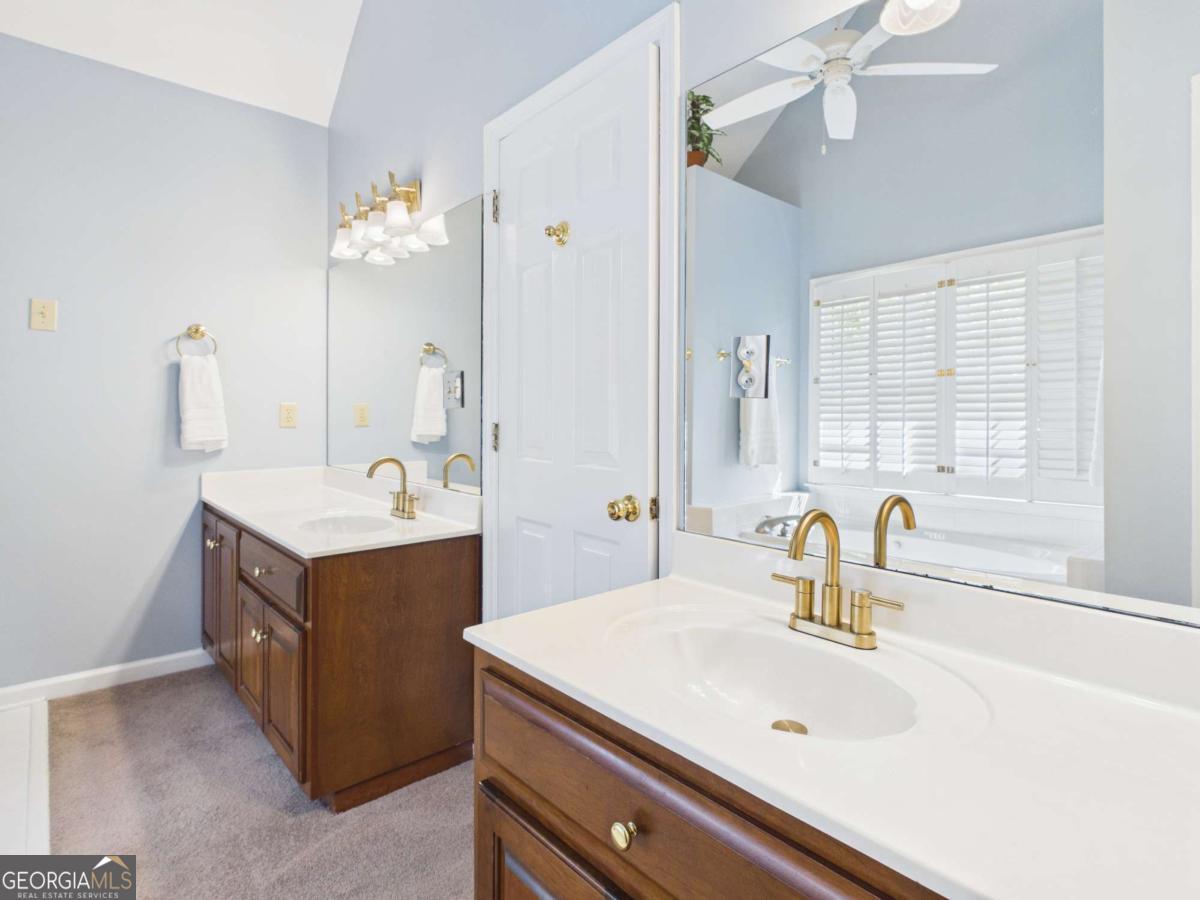 1120 Laurel Pointe Watkinsville, GA 30677 - Photo 25 of 50 a bathroom with a sink vanity and mirror