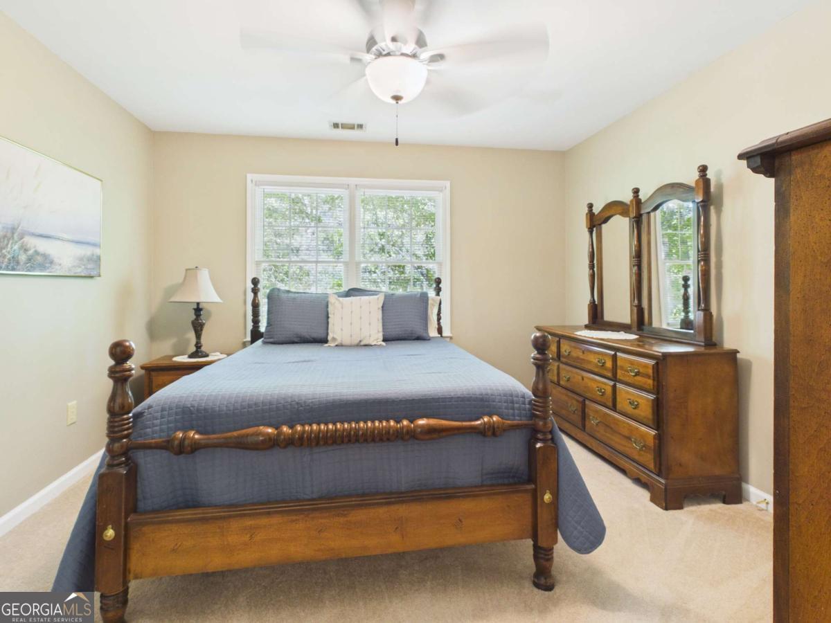 1120 Laurel Pointe Watkinsville, GA 30677 - Photo 30 of 50 a bedroom with a bed and window
