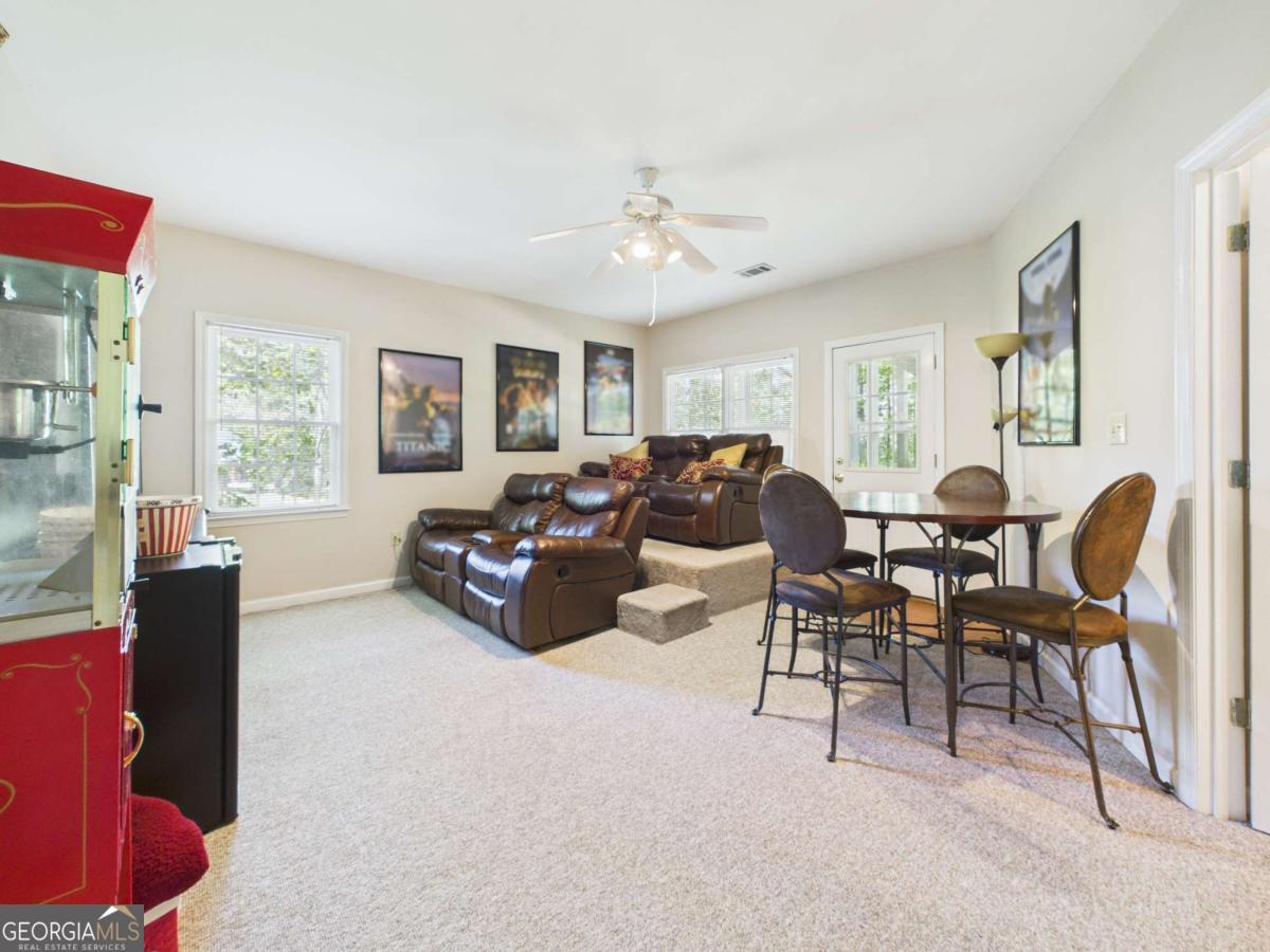 1120 Laurel Pointe Watkinsville, GA 30677 - Photo 36 of 50 a living room with furniture and a large window