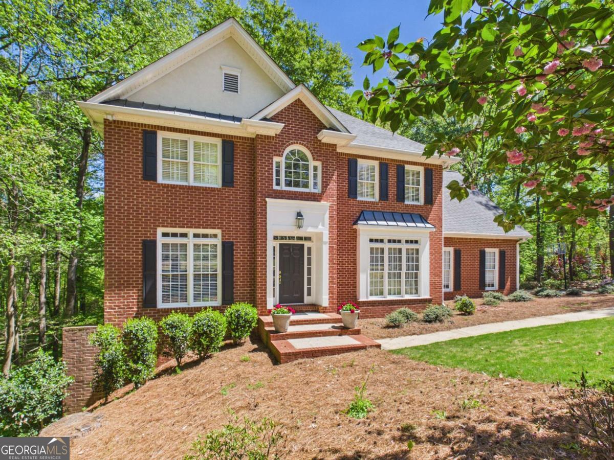 1120 Laurel Pointe Watkinsville, GA 30677 - Photo 42 of 50 a front view of a house with a yard