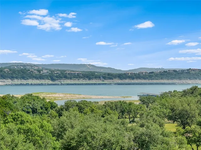 a view of lake with mountain in the background