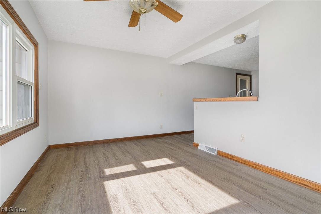 2942 17th Street Northwest Canton, OH 44708 - Photo 12 of 25 Unfurnished room featuring light hardwood / wood-style floors and ceiling fan