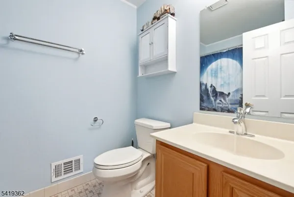 a bathroom with a sink toilet and vanity