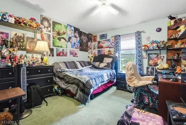 a bedroom with a bed and furniture