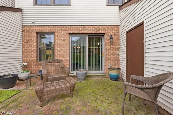 a view of house with outdoor seating space